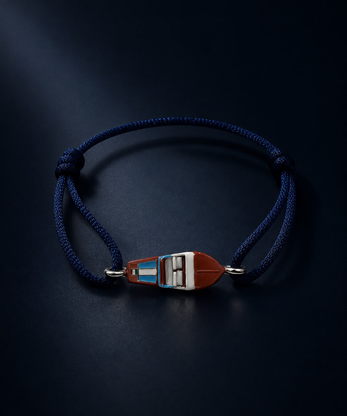 The Oligarch Cord — woven cord bracelet with NEPO Express tag charm