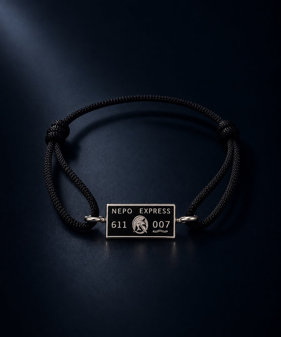 The NEPO Baby Cord — woven cord bracelet with hand-painted porcelain charm