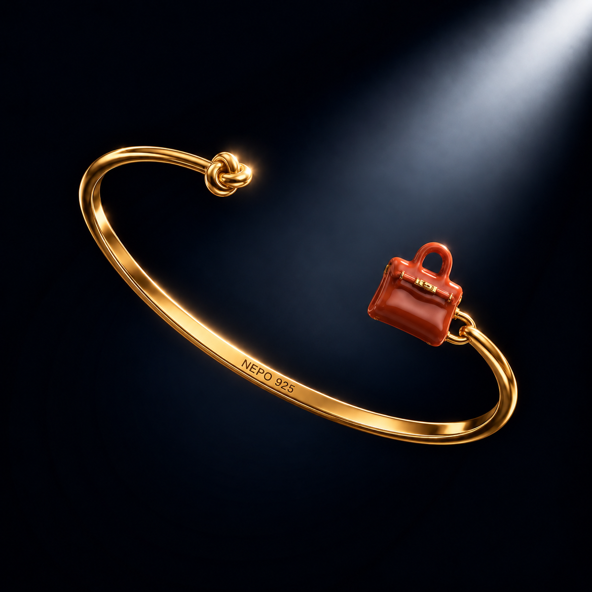The Heiress — gold-plated knot bangle with hand-painted red bag charm